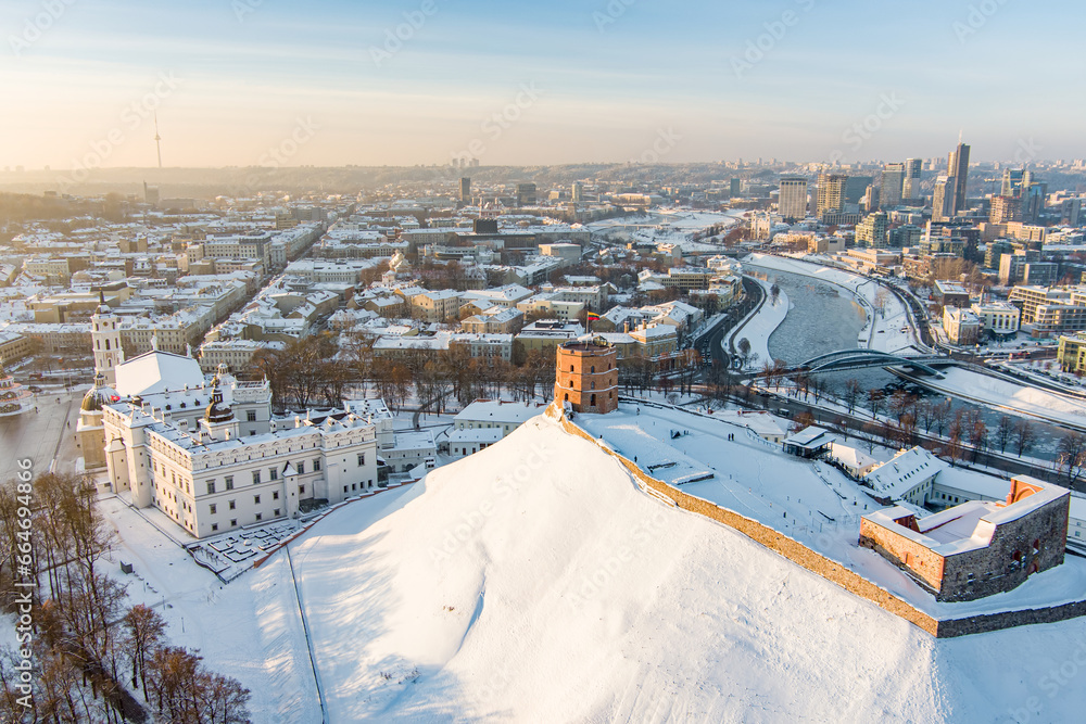 Beautiful sunny Vilnius city scene in winter. Aerial early evening view. Winter city scenery in Lithuania. - obrazy, fototapety, plakaty 