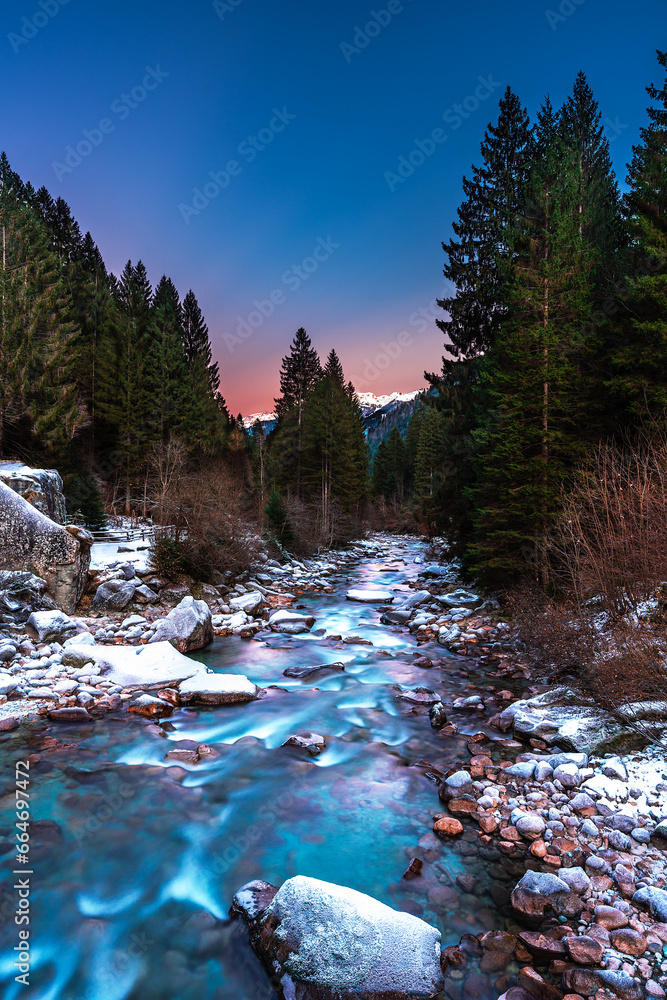 Nardis Waterfall in winter in the mountains at sunset, Trento, Val di Genova, Italy. Beautiful winter landscape in the Dolomites. Nardis Waterfall in winter in the mountains at sunset, Trento, Val di Genova, Italy. Beautiful winter landscape in the Dolomites.