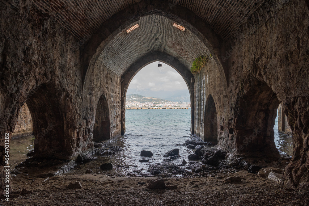 Stone arches of medieval Tersane shipyard in Alanya, Turkey.