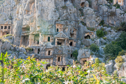 Lycian rock tombs of Myra ancient site in Antalya province of Turkey. Lycian rock-cut tombs are in the form of temple fronts carved into the vertical faces of cliffs.