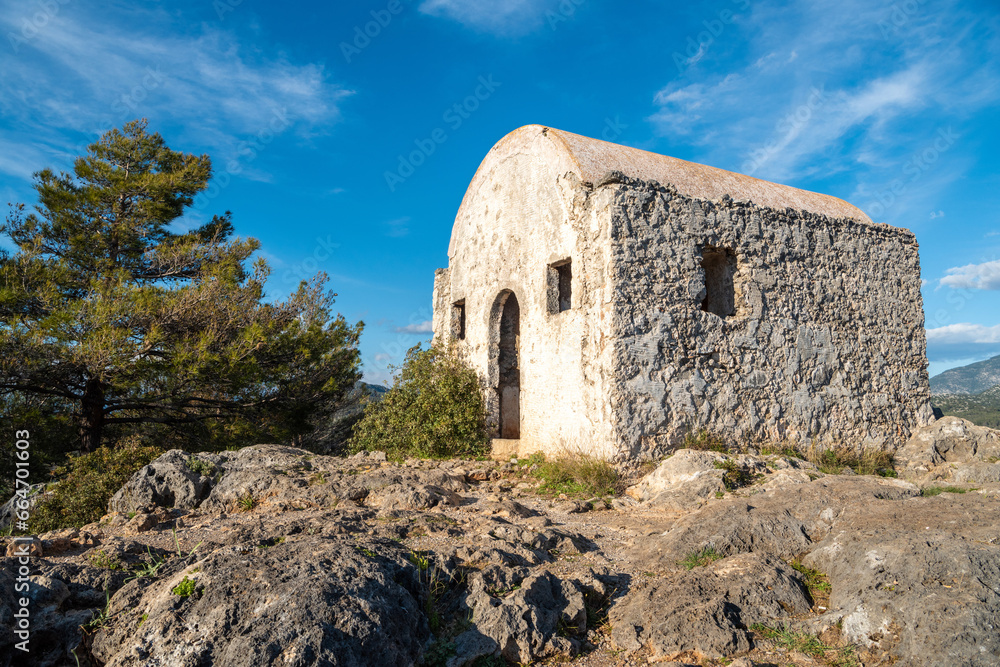 Ruined hilltop chapel at Kayakoy (Levissi) abandoned village near Fethiye in Mugla province of Turkey. 