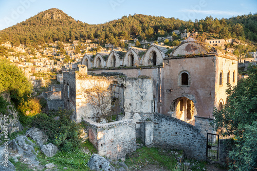 Ruined Taksiyarhis upper church of Kayakoy (Levissi) abandoned village near Fethiye in Mugla province of Turkey. The church dates from the 19th century.  photo