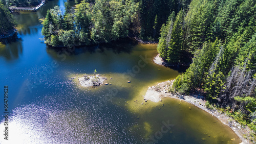 Shallow at Rice Lake, North Vancouver. Rocky outlets bright white on a sunny day