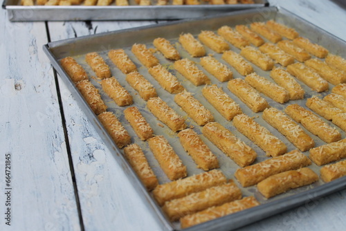 Rows of Indonesian cakes called kastangel on a table ready to serve photo