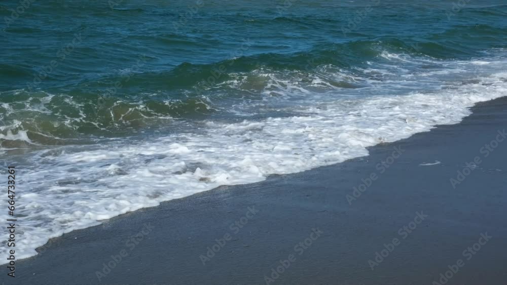 Big foamy waves crashing on the beach. Seaside on a windy day. Storm Big foamy waves crashing on the beach. Seaside on a windy day. Storm