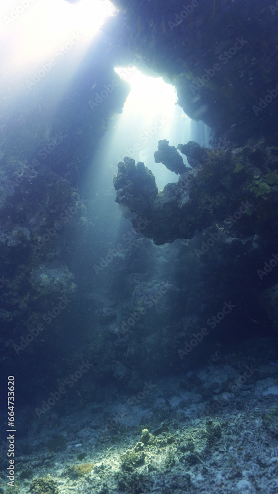 Underwater photo of rays of sunligt inside a cave Underwater photo of rays of sunligt inside a cave
