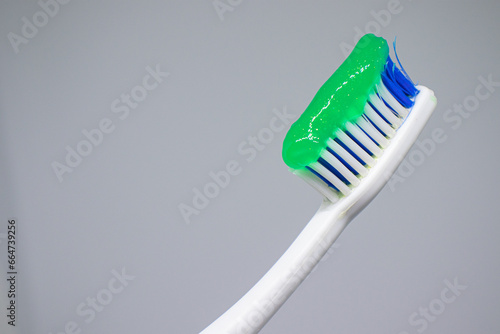 green toothpaste on a toothbrush