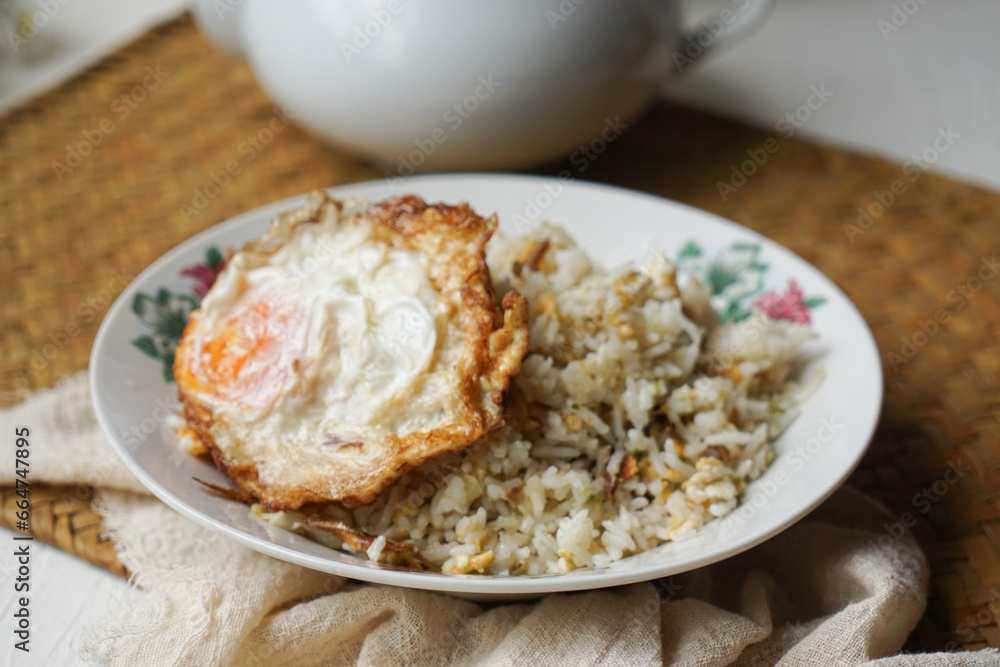 Fried rice (nasi goreng kampung) and fried egg Fried rice (nasi goreng kampung) and fried egg