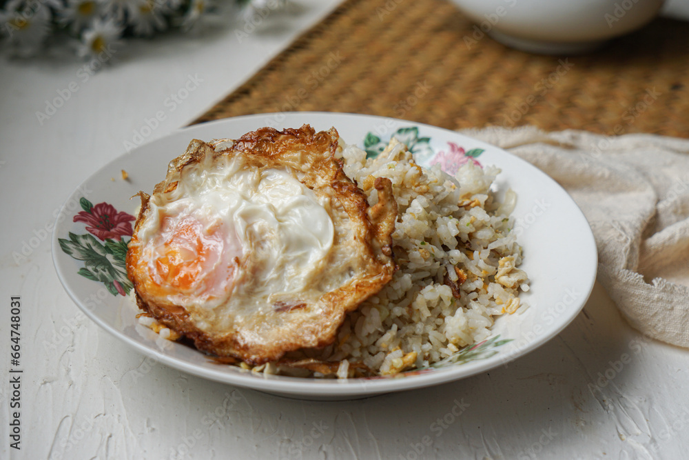 Fried rice (nasi goreng kampung) and fried egg Fried rice (nasi goreng kampung) and fried egg