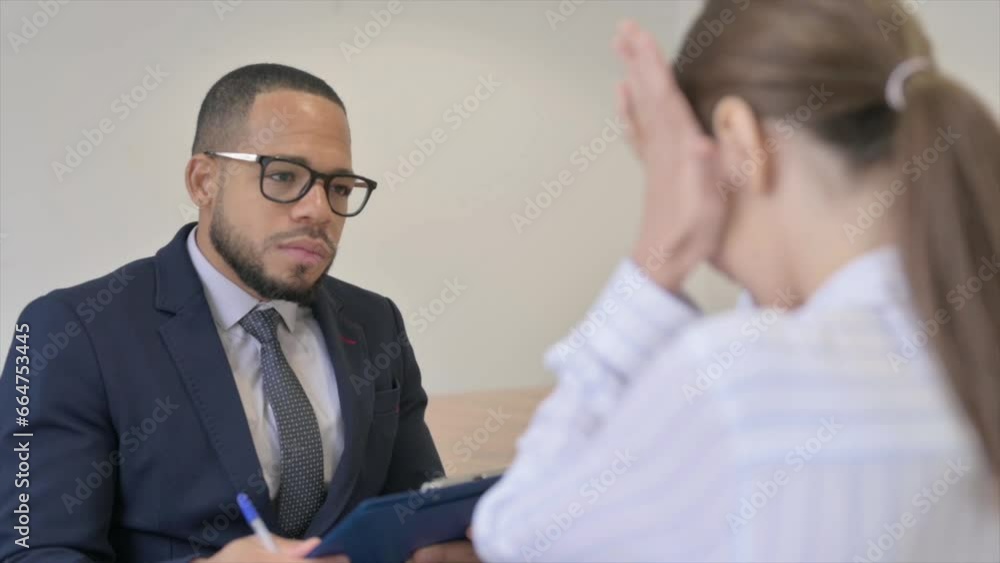 Upset female with Headache while sitting in session with Counselor Upset female with Headache while sitting in session with Counselor