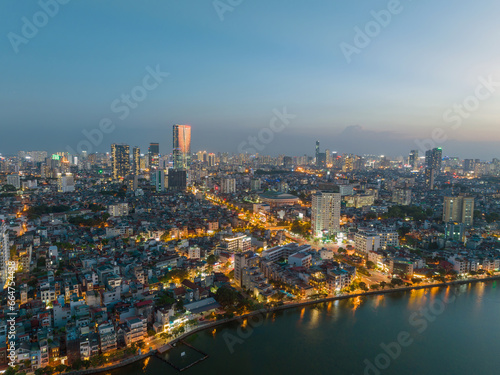 Hanoi skyline cityscape in Ho Tay West Lake with lake and city buildings