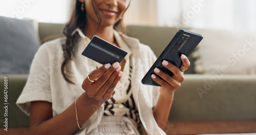 Happy woman, hands and phone with credit card for online shopping, payment or transaction in living room at home. Closeup of female person or shopper on mobile smartphone with debit for ecommerce photo