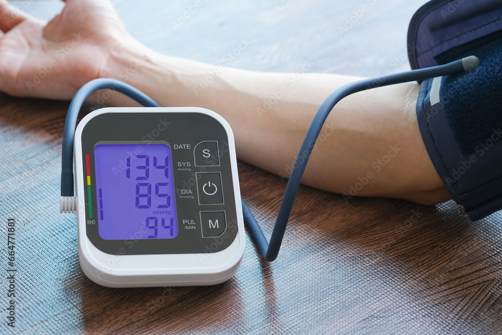 Men's health check blood pressure.and heart rate with digital pressure gauge  standard blood pressure test results .Health and Medical concept - obrazy, fototapety, plakaty 