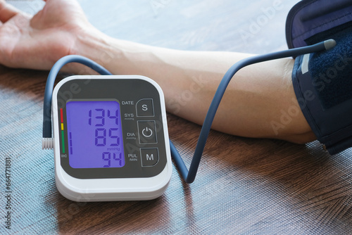 Men's health check blood pressure.and heart rate with digital pressure gauge  standard blood pressure test results .Health and Medical concept