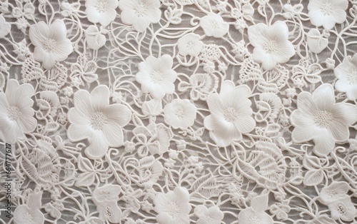 Closeup of a vintage fabric pattern with elegant lace and floral embroidery. Decorative wedding texture design.