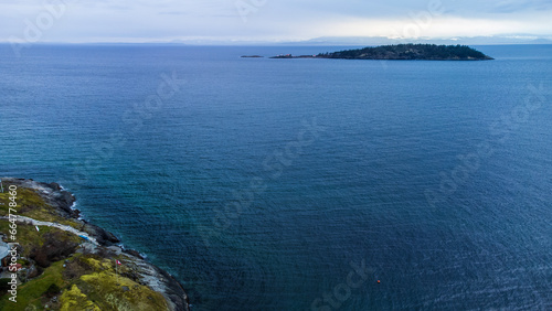 View of Merry Island on the Sunshine Coast. Across the Georgia Straight, in the distance, Vancouver Island