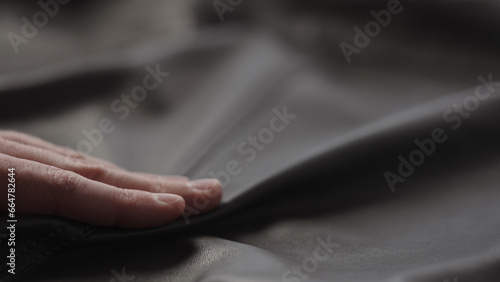 Closeup man touching fine leather