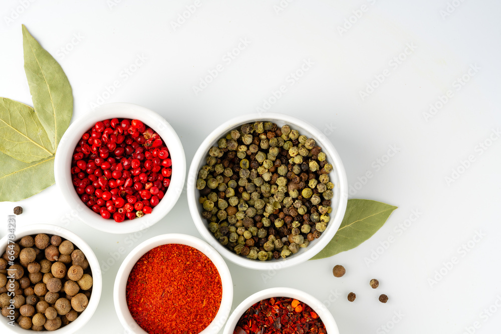 Various spices in a bowls on white background Various spices in a bowls on white background
