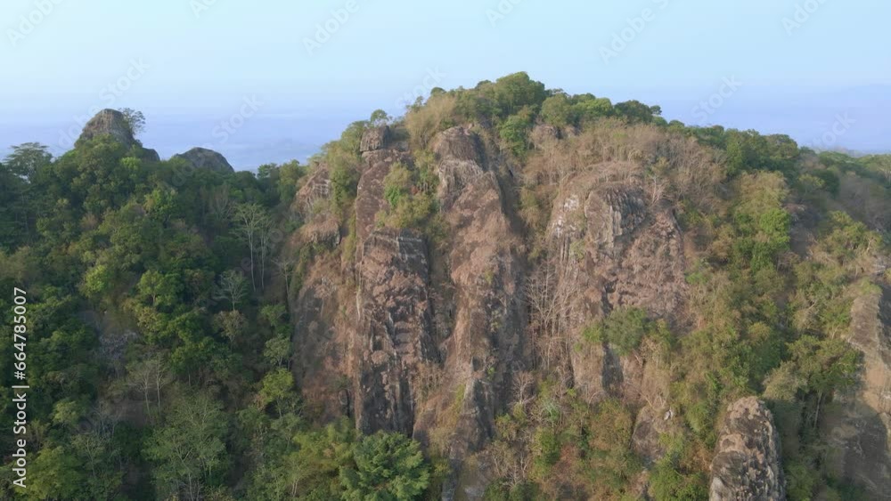 Aerial pan shot of Pre historic volcano of Nglanggeran in Wonosari Yogyakarta, Indonesia. Ancient Volcano. Aerial pan shot of Pre historic volcano of Nglanggeran in Wonosari Yogyakarta, Indonesia. Ancient Volcano.