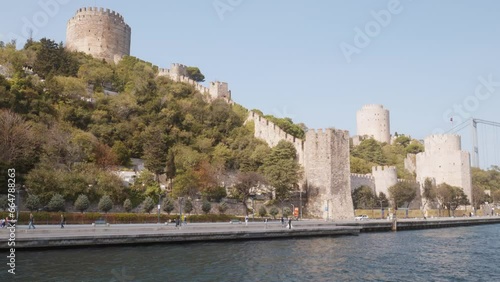 Rumeli stone Fortress shores of Bosphorus strait cruise boat scenery photo