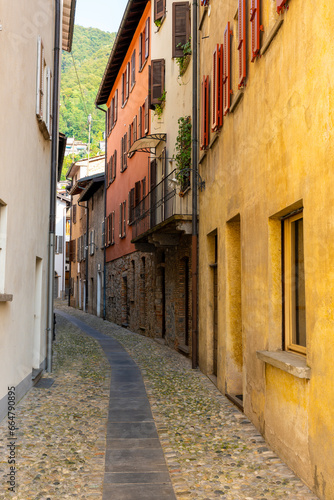 Beautiful Old Narrow Street with Old Building with Sunlight in Bissone, Ticino, Switzerland. photo