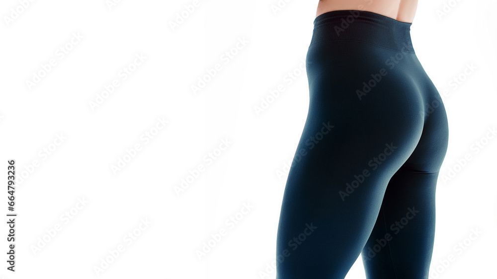 Close up view of sexual sporty tempting beautiful attractive nice round ass wearing tight leggings - obrazy, fototapety, plakaty 
