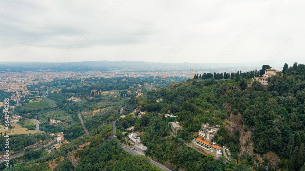 Florence, Italy. Villa on a mountain covered with forest. Suburb. Summer, Aerial View