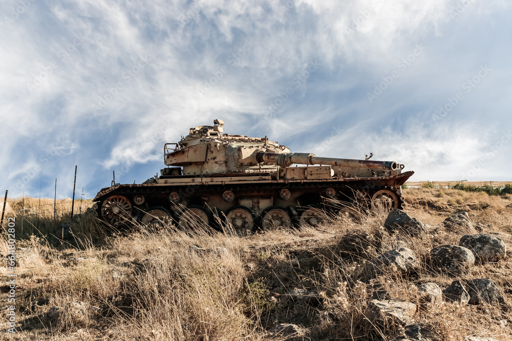 Fototapeta premium The remains of Israeli tank destroyed during Yom Kippur War in the Valley of Tears near the border with Syria on Golan Heights in northern Israel