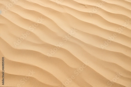 Closeup of sand pattern of a beach in the summer. © Mehdi