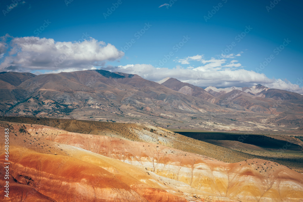 Stunning panoramic view of the mountains under blue sky with white clouds. Vast expanses of Asian steppes.