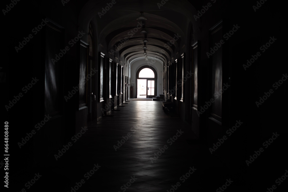 Atmosphere inside a large building with the lights off