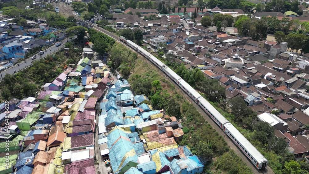 Aerial shot of a train in Malang city, Java, Indonesia Aerial shot of a train in Malang city, Java, Indonesia