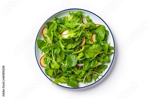 Healthy fresh green salad plate shot from above on white background.