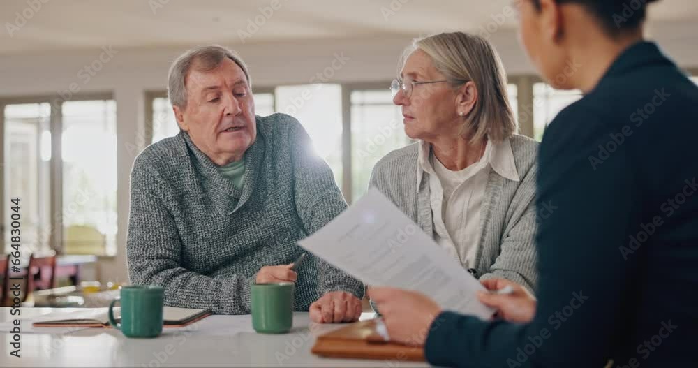 Senior couple, lawyer and documents with discussion for investment, will or life insurance in home. Attorney, old man and elderly woman with paperwork, contract or negotiation for property in house Senior couple, lawyer and documents with discussion for investment, will or life insurance in home. Attorney, old man and elderly woman with paperwork, contract or negotiation for property in house