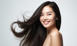 Portrait of a beautiful Asian woman with a bright smile, hair is a beautiful black color, shampoo advertising concept Hair conditioner and cosmetic products,Generative AI