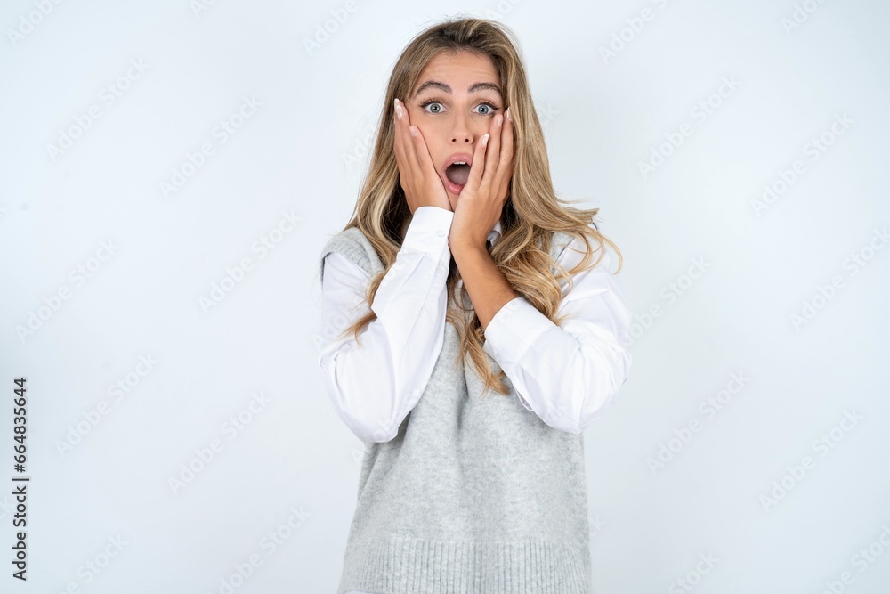 Scared terrified Young beautiful woman shocked with prices at shop, People and human emotions concept Scared terrified Young beautiful woman shocked with prices at shop, People and human emotions concept