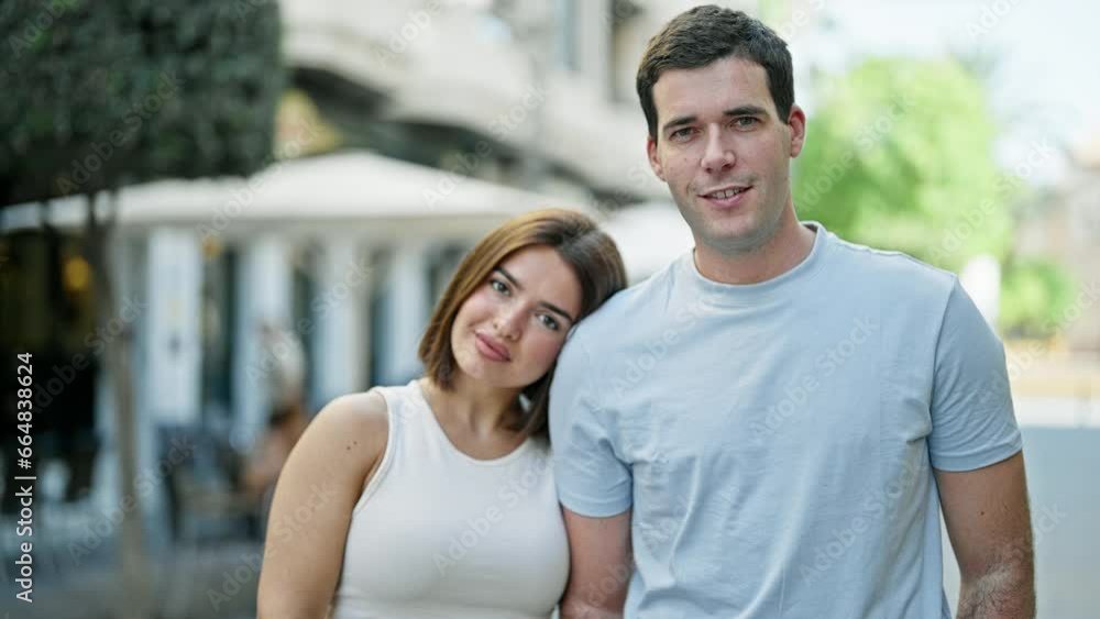 Beautiful couple smiling confident standing together at street Beautiful couple smiling confident standing together at street