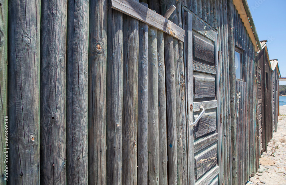 Weathered wooden walls built with logs