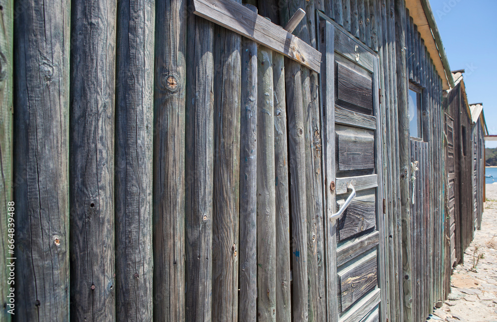 Weathered wooden walls built with logs Weathered wooden walls built with logs