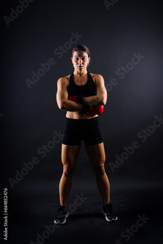 Young woman athletic female MMA fighter training. Concept of sport  action  healthy lifestyle.