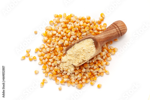 Top view of a wooden scoop filled with organic Corn (Zea mays Flour. Isolated on a white background.