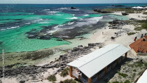 Aerial over Rottnest Island, sandy shores gently caressed by the crystal-clear waters of the Indian Ocean, Longreach Bay offers a haven of natural beauty and tranquility. Vacation concept. photo