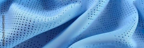 Breathable fabric dry light blue soft mesh holes floating light blue background. photo