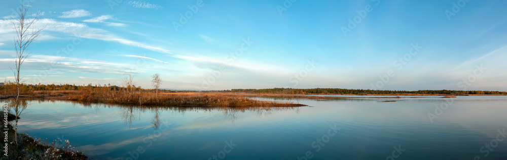 Panorama lake view in sunrise time .Sunrise at the lake Panorama lake view in sunrise time .Sunrise at the lake
