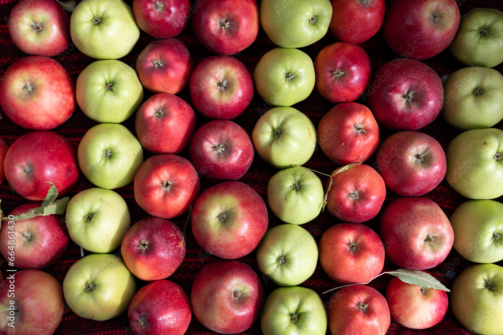 Background of red apples and ripe grapes. Fruit texture. Background of red apples and ripe grapes. Fruit texture.
