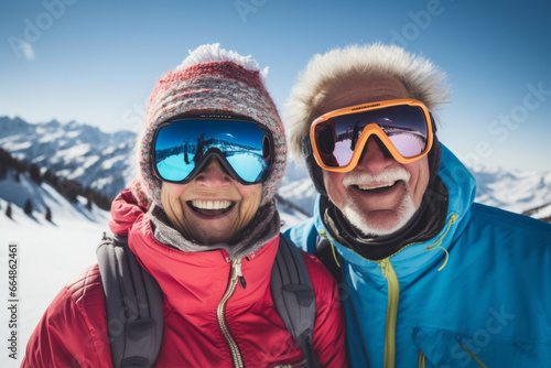 Happy elderly couple skiing in the Alps mountains. Senior man and woman enjoying ski vacation in alpine resort. Active retirement. Healthy winter sport for every age.