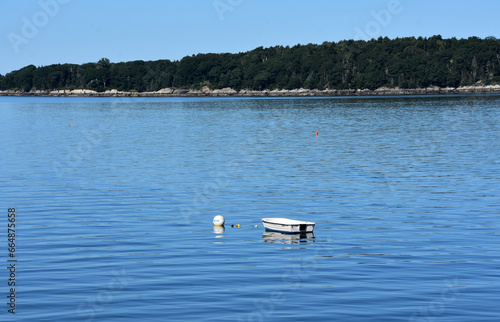 Fototapeta Naklejka Na Ścianę i Meble -  Dinghy Anchored in the Waters off an Island