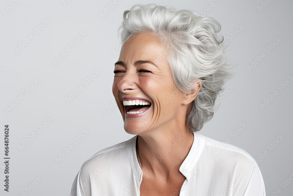 portrait of a mature woman laughing portrait of a mature woman laughing