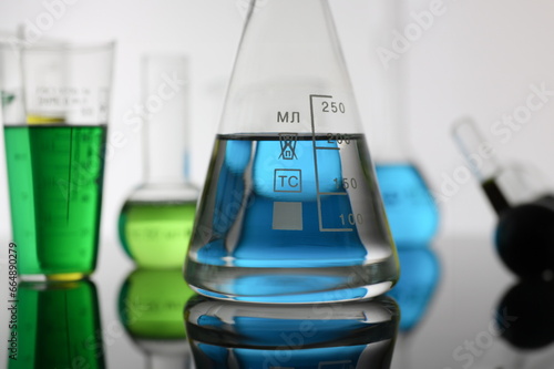Chemical industry bulb with blue magenta test tube background
