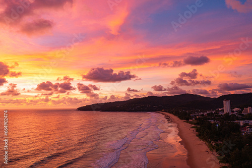 exotic pink red sky in sunset at Karon beach Phuket..Scene of colorful romantic sky sunset with changing the brilliant yellow sky gradually turned red. .beautiful sky of sunset in nature and travel 